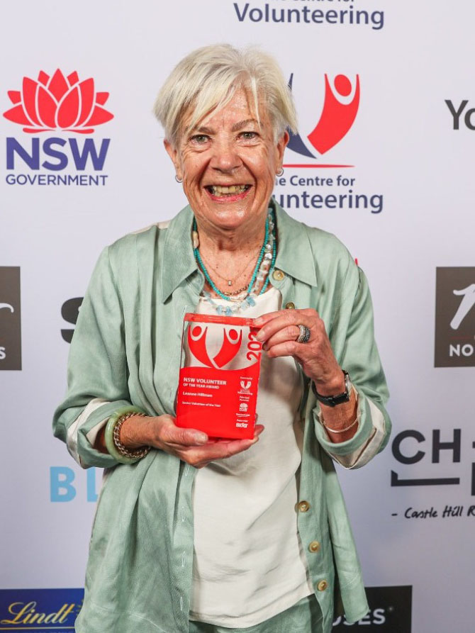 Leanne Hillman holding NSW Volunteer of the Year award